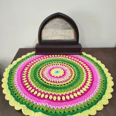 Here, the Viola mandala is used as a decorative mat on a side table. It adds a wonderful pop of color and handmade charm to the room.