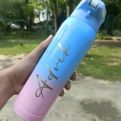 A beautiful dual-tone steel bottle engraved with the name 'Advik.' The color gradient from pink to blue makes it very eye-catching.