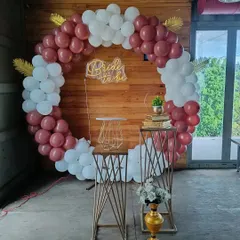 A straight-on view of the 'Bride to be' bachelorette party decoration. The combination of deep red and white balloons creates a classic and bold statement, suitable for both day and evening celebrations in Bengaluru.