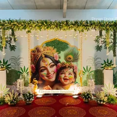This Krishna theme backdrop is one of our most loved designs. The vibrant colors and the loving depiction of mother and child bring a special warmth to any event.