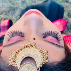 An artistic close-up focusing on the eye makeup. This shot highlights the dramatic false lashes and vibrant pink eyeshadow, showcasing a more creative and bold side of my work.