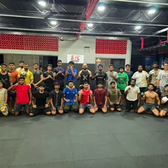 A group photo of our fighters after a tough training session. The sweat and hard work bring us closer as a team. Everyone is welcome here.