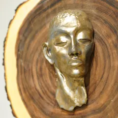 The evolution of a sculpture. This series shows a hand-built portrait bust from its raw clay form, to post-bisque firing, and finally with two different metallic glaze finishes.