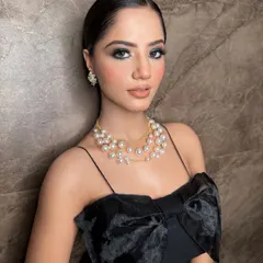 An elegant party look for this stunner. The dark, smokey eyes are the star of the show, balanced with a neutral lip and glowing skin.