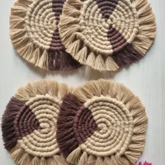 These two-toned brown and beige macrame coasters have a lovely, earthy feel. The spiral design is mesmerizing, and the fringe adds a soft texture.