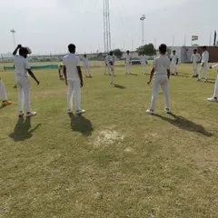 A quick huddle during a fielding drill session. Fitness is not just physical; it is also about communication and strategy, which we integrate into our on-field conditioning to build smarter players.
