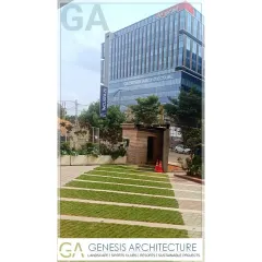 The entrance landscape for a corporate office in Bangalore. We used permeable grass pavers to create a green driveway that helps with groundwater recharge, combining functional, sustainable design with a professional aesthetic.