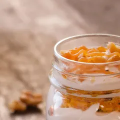 Our Carrot Walnut Jar is a deconstructed classic. We layer moist carrot cake, creamy frosting, and crunchy walnuts in a convenient jar for a delightful dessert experience.