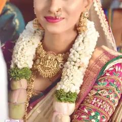 A candid moment with one of my real brides. This is the look of pure happiness I strive for. Her makeup is soft and natural, designed to last through all the emotions of the wedding day, and is complemented by a beautiful jasmine garland.