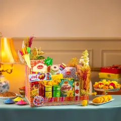 A beautifully arranged Holi gift basket with traditional sweets, thandai mix, and herbal colors.