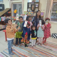 So much pride and joy. The children are thrilled to show off the bookmarks they created after a story about friendship, each one uniquely decorated.