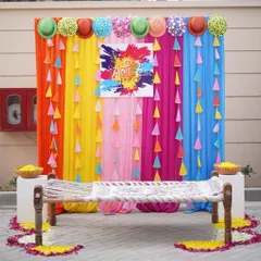 A corporate event should be fun and engaging. I designed this vibrant Holi photo booth with a traditional charpai and a rainbow of colors to create a perfect spot for employees to capture joyful moments and make lasting memories together.