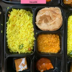 A detailed look inside the special observance meal box, perfect for days like Paryushan.