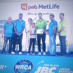 Our student Akshita being honored on stage at the PNB Metlife Junior Badminton Championship. Success at such events demonstrates our ability to prepare players for high-stakes competition.
