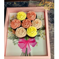 My cupcake bouquets are a popular gift for any celebration. This Mother's Day version features seven chocolate cupcakes with hand-piped buttercream roses, arranged beautifully in a gift tray.
