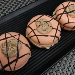 This is a cold process donut soap I made. It's formulated with nourishing oils like olive and coconut oil for a creamy, moisturizing lather.