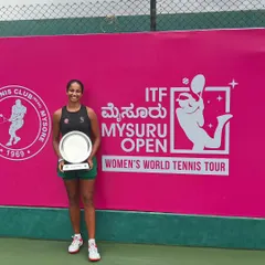 Celebrating a significant victory on the international stage. Our player Riya Bhatia proudly holds the doubles championship trophy at the ITF W15 Mysuru Open, a key milestone on the Women's World Tennis Tour.