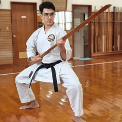A young black belt student practices with the Eku, a traditional Okinawan weapon derived from a boat oar. Kobudo training at the Honbu Dojo in Okinawa helps us maintain the authenticity of our weapon arts.