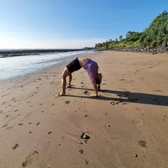 Backbend on the beach. Releasing pent-up emotions with a wheel pose is a therapeutic experience, especially with the sound of the waves.