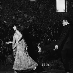 A fun, candid moment on the dance floor. This black and white shot captures the energy and movement of the reception party.