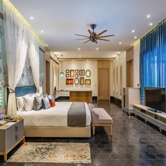A whimsical suite at Taj Devi Ratn, Jaipur, where I used a custom hot-air balloon themed wallpaper to evoke a sense of fantasy and flight. The design combines playful motifs with luxurious textiles and a canopy bed to create a truly unique and soulful room.