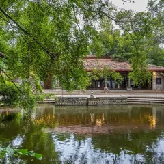 The serene Pond Pavilion reflected in the calm waters of the Kalyani at dusk. This view captures the tranquil, nature-inspired setting that makes our venue a peaceful escape from the city.