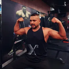 Flexing after a good workout. I believe a coach should be a role model of the strength and dedication he asks from his students.
