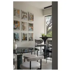 A cozy corner in our studio, Ruh HQ. This space, with its gallery wall of our projects, is where we meet, brainstorm, and dream up new ideas.