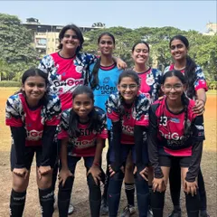 Our girls' team posing together at the MBCL tournament. Competing in such events is a key part of their development, teaching them teamwork and resilience.