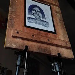 My abstract pen art on my easel. I even make my own simple frames to complete the look of these unique pieces.