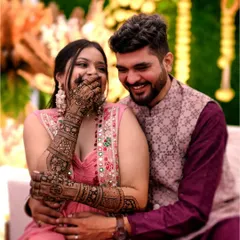 A candid moment of laughter between the bride and groom. Her beautiful mehndi is a part of their happy memories.