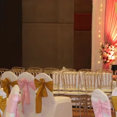 A view of the guest seating, showing a mix of classic chairs with bows and transparent ghost chairs, offering different styles for different areas of the venue.
