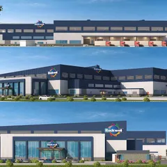 3D renderings of the Rockwell Cooltech facility, a project designed to achieve IGBC Platinum certification. The design features a modern corporate facade combined with large-scale industrial warehousing and loading docks.