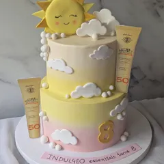 I created this two-tier cake to celebrate the 8th anniversary of Indulgeo Essentials and the launch of their new sunscreen. It features a soft, sky-like buttercream finish and fully edible replicas of the product, turning a brand milestone into a delicious work of art.