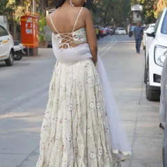 The back of our ivory floral lehenga features a beautiful corset-style tie-up, adding a modern touch to this classic piece.