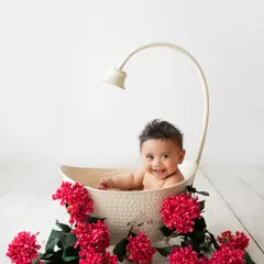 This little one is loving his floral bath session. The pop of red flowers against the clean white background is just stunning.
