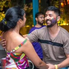A happy, color-smeared moment between two dancers. Combining the festival of colors with Latin dance was a huge success.