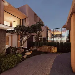 The 'Gemini House' is our architectural solution for conjoined living, where two distinct residences are united in a single, harmonious design. The earthy materials and expansive glass walls blur the line between inside and out, creating a shared living experience that is deeply connected to the surrounding landscape.
