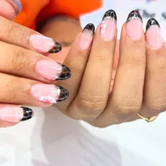 A dark and elegant tortoise shell pattern used for a French tip, creating a unique and trendy look.