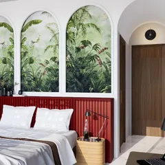 This bedroom is a symphony of elegance and funk. The arched niches with tropical wallpaper create a dramatic backdrop, while the bold red headboard adds a vibrant pop of color. It's a sanctuary that is full of personality and dances with the drama of sunlight.