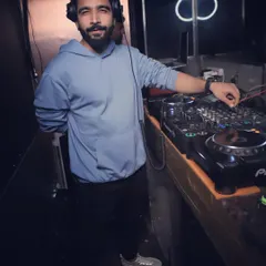 A more casual look from a recent gig. Whether it's a hoodie or a suit, the focus on the music and the crowd is always the same.