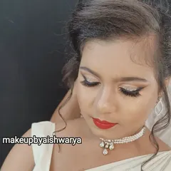 A close-up of the Christian bridal makeup, showing the sharp winged eyeliner and shimmering eyeshadow. This technique defines the eyes beautifully while maintaining an overall soft and elegant feel.