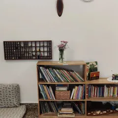 Our reading corner, with a curated collection of books and natural treasures on display. We create cozy, beautiful nooks that invite quiet exploration and a love for stories and learning.