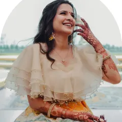 The complete look, radiating happiness and effortless style. The intricate henna design complements the festive feel of the custom lehenga.