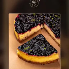 A slice of my blueberry cheesecake, featuring a creamy, rich filling on a buttery biscuit base, topped with a generous layer of sweet and tangy blueberry compote.