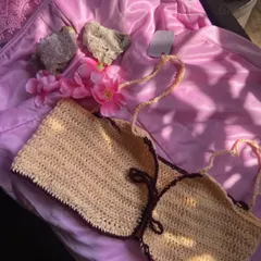 A close-up of one of my handmade halter bikini tops. This one shows a two-tone design with a light cream body and a dark brown border, but you can pick any color combo you want. The straps are fully adjustable for a perfect fit.