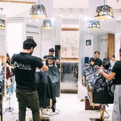 Our salon is a place for everyone. Here you can see our team working on men's, women's, and kids' haircuts all at once.