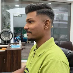 This client wanted a fresh, stylish look. I gave him a high-volume pompadour with a clean skin fade, a popular choice for a bold and modern hairstyle.