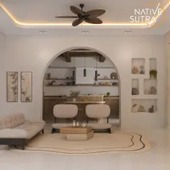An open-plan living and kitchen area designed in a Minimal Organic Mediterranean style. The arched doorway, neutral color palette, and sculptural furniture create a serene and timelessly elegant atmosphere.