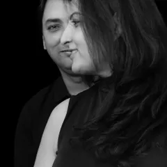 Half and half makes one. This intimate, black and white couple's portrait uses creative composition to symbolize their partnership and the new life they have created together. It's a classic yet modern take on maternity photography.